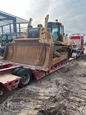 Used Komatsu Dozer on trailer bed